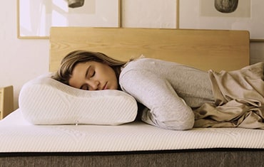 girl sleeping on memory foam pillow